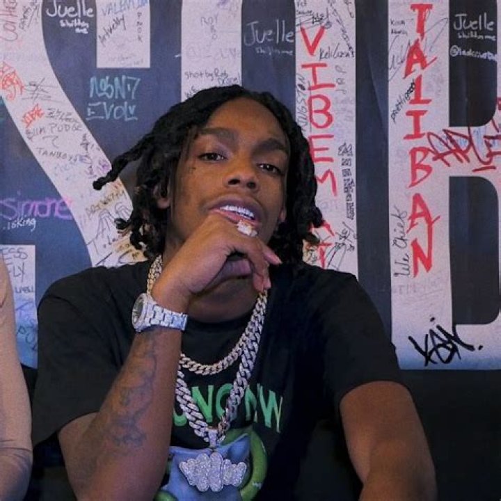 YNW Melly is an American rapper and singer. His music combines elements of hip hop, trap, and R&B. He gained popularity with his songs “Murder on My Mind,” “Mixed Personalities” featuring Kanye West, “Suicidal” featuring Juice Wrld, and “223’s” featuring 9lokkNine. Throughout his career, Melly has faced legal issues, including previous arrests for assault, probation violations, and possession of marijuana and firearms. Despite his detention, Melly released his debut studio album, “Melly vs. Melvin,” in November 2019, which reached number eight on the Billboard 200 chart You May Also Like To Check Out: Does Yeat Say The N Word? Rapper’s Real Name Age And Wiki YNW Melly Ethnicity – Is He African? YNW Melly, whose real name is Jamell Maurice Demons, is of African-American ethnicity. Being African-American means that his ancestry can be traced back to people of African descent who were brought to the United States during the period of the slave trade. Being a singer and songwriter, he features his cultural heritage into his music. His style and lyrics often reflect the experiences and perspectives of the African-American community. YNW Melly Ethnicity YNW Melly giving out his performance to his fans (Source: Urban Islandz) It’s important to acknowledge and celebrate the diverse ethnic backgrounds of artists like YNW Melly, as their cultural heritage can greatly shape their artistic expression and contribute to the rich group of music and culture. He is African-American ethnicity is an integral part of his identity and artistic journey. Which Religion Does YNW Melly Belong To? YNW Melly’s religious beliefs have been a topic of curiosity among his fans and the public. While he has not explicitly stated his religious affiliation, there are indications in his lyrics that suggest a connection to Christianity. In one of his songs, he mentions God and Jesus, expressing belief in their existence and referencing the practice of sanctification, which holds significance in Christian traditions. It’s important to remember that artistic expression often involves illustrative language, so these references may not necessarily reflect Melly’s religious practices or the full extent of his spiritual beliefs. YNW Melly Ethnicity YNW Melly at the court for his trial of the first-degree murder (Source: iNews) However, the mention of God and Jesus in his lyrics suggests a spiritual preference toward Christianity. As YNW Melly continues to navigate his personal and legal challenges, including facing charges of double murder, his religious beliefs may provide him with comfort, guidance, or support. Ultimately, the nature of his religious practices remains known only to him, and he must share or express them further if he chooses to do so. YNW Melly Parents YNW Melly, born Jamell Maurice Demons, was raised by his mother, Jamie Demons-King, in Gifford, Florida. She is a single parent who faced financial struggles while raising him. The identity of his biological father remains unknown, although there have been claims made by rapper Donte “Tha Gift” Taylor stating that he is his father. However, these claims have not been confirmed. Despite the challenging circumstances, Melly’s talent and passion for music began to emerge at a young age. He found support and influence from his family, including his mother and younger brother, YNW BSlime, who is also a rapper. YNW Melly Ethnicity Ynw Melly mother is praying for his release (Source: Digital Music News) Their encouragement played a significant role in shaping YNW Melly’s life and career. Overall, YNW Melly’s family, particularly his mother, has played a crucial role in his upbringing and the support he received has influenced his journey in the music industry.